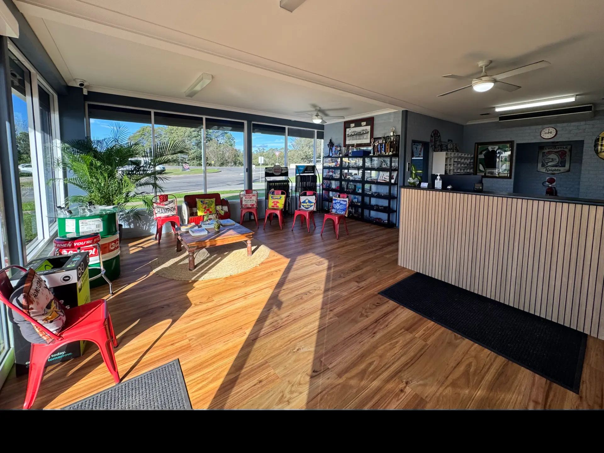 The sunlit customer waiting area and service counter at Tanilba Bay Automotive